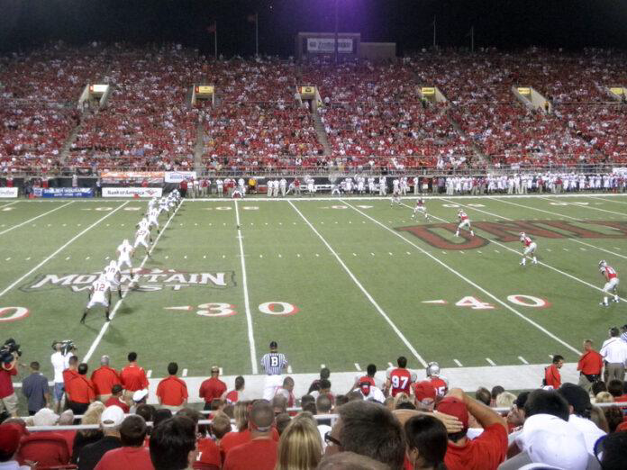 football game, college football, stadium, crowd, night game, red team, field, sports