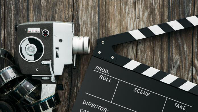 film production, movie camera, clapperboard, film reel, cinema equipment, filmmaking, vintage camera, movie production