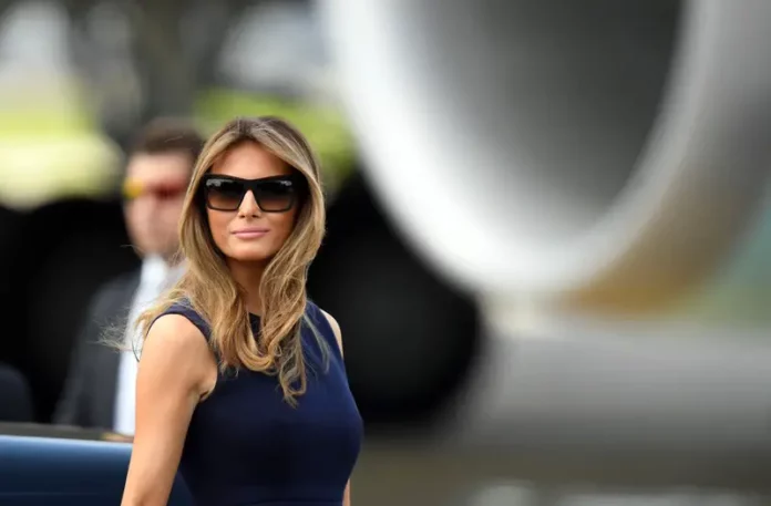 Melania Trump, First Lady, sunglasses, navy dress, outdoor event, political figure