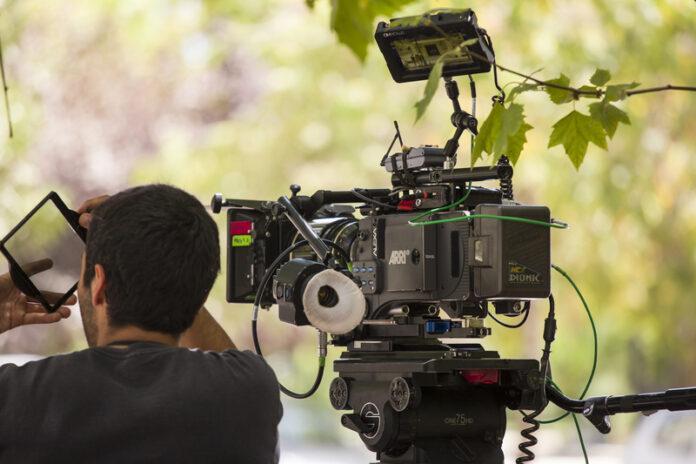 camera operator, film production, cinematographer, film crew, movie camera, ARRI camera, professional filmmaking, on location shoot