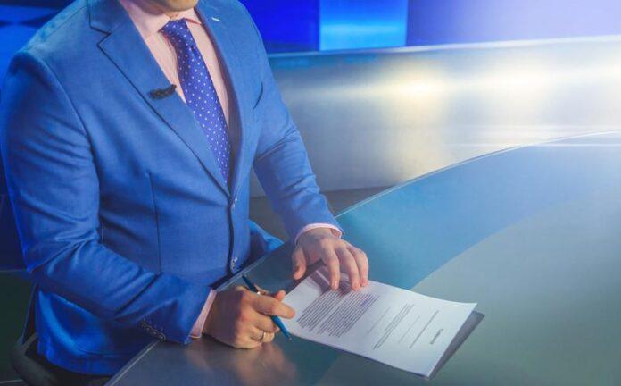 News Anchor at Desk