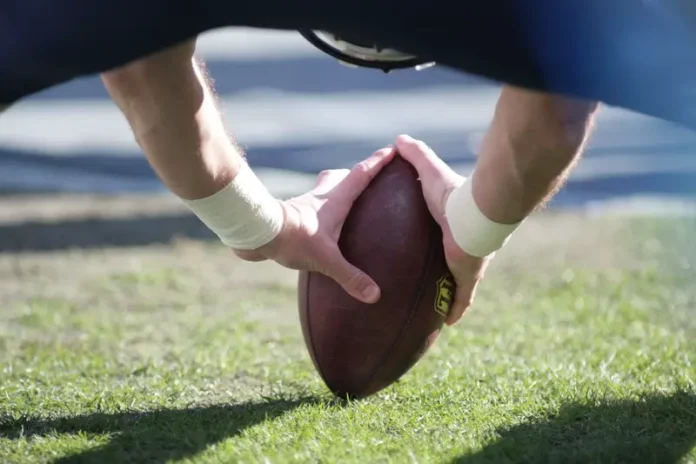 Football Player Catching Ball