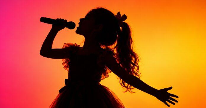 Young-Girl-Singing-on-Stage