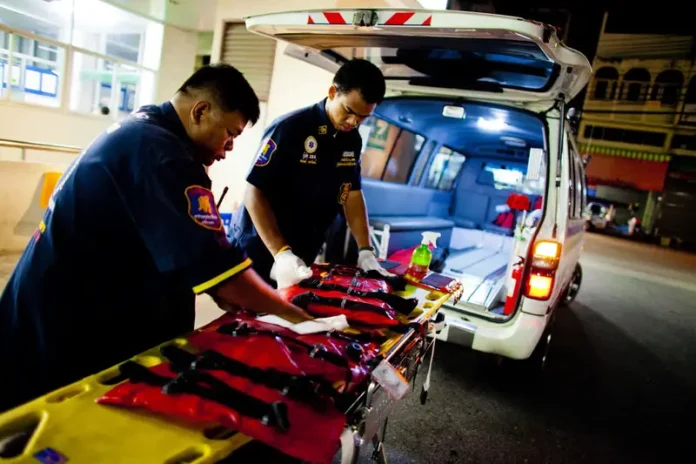 Paramedics Preparing Ambulance Equipment